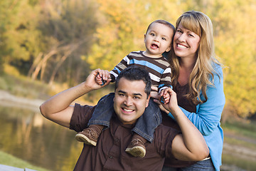 Image showing Happy Mixed Race Ethnic Family Posing for A Portrait