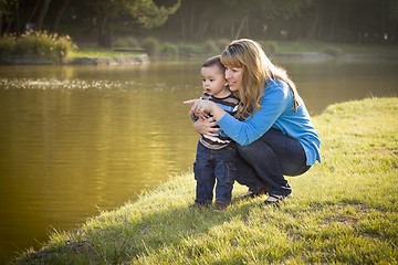 Image showing Happy Mother and Baby Son Looking Out At Lake