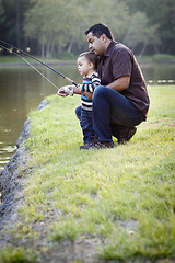 Image showing Happy Young Ethnic Father and Son Fishing