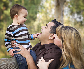 Image showing Happy Mixed Race Ethnic Family Playing In The Park