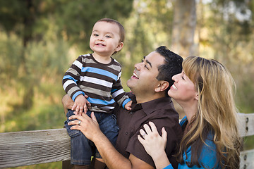 Image showing Happy Mixed Race Ethnic Family Playing In The Park