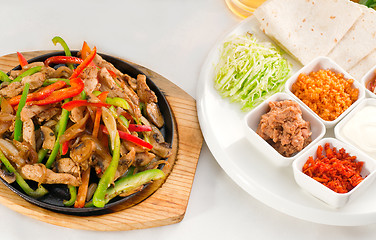 Image showing original fajita sizzling hot  on iron plate