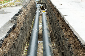 Image showing Installing pipes for hot water and steam heating