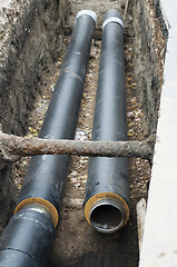 Image showing Installing pipes for hot water and steam heating