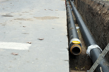 Image showing Installing pipes for hot water and steam heating