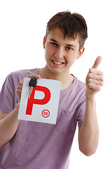 Image showing Teen boy holding P plates and car key