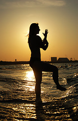 Image showing Sunset Tai Chi on a beach