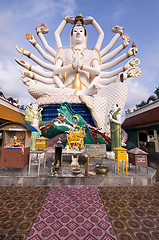 Image showing Eighteen arms Buddha over blue sky