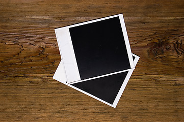 Image showing Blank photo frames over wood