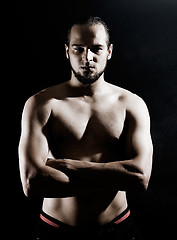 Image showing Muscular man over black