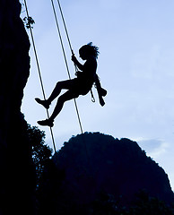 Image showing Climbing woman silhouette