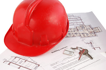 Image showing Keys and helmet on building contract