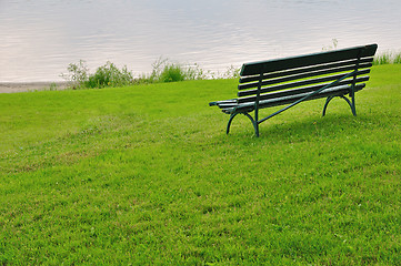 Image showing Bench by river