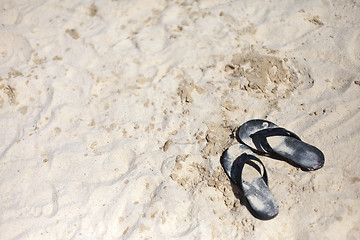 Image showing Beach sandal on the sandy sea coast