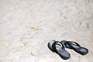 Image showing Beach sandal on the sandy sea coast