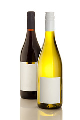 Image showing White and Red wine on the white reflecticve table