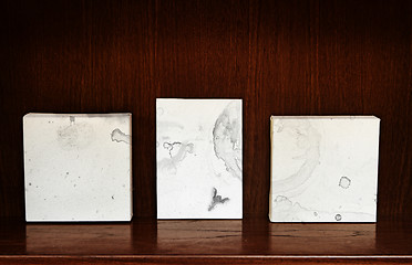 Image showing canvases on a shelf