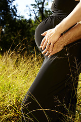 Image showing pregnant couple in grass