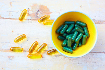 Image showing fish oil vitamins  and herbal pills