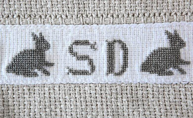 Image showing Easter bunny Cross-stitch on cotton blanket.