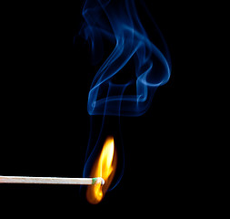 Image showing Green headed match starts to smoulder