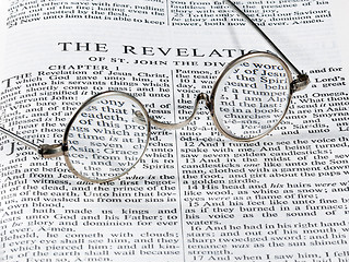 Image showing Antique reading glasses on page of bible