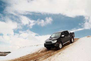 Image showing Pickup truck driving down the hill