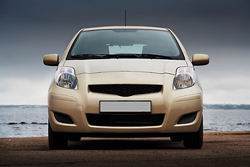 Image showing Front view of a beige car