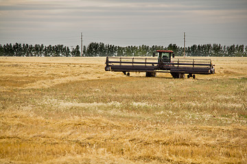 Image showing Combine harvester in a wheat field