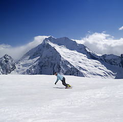 Image showing Snowboarder in high mountains