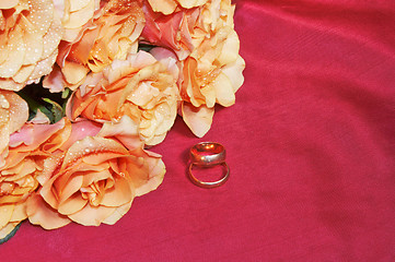 Image showing wedding rings and roses