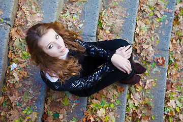 Image showing Girl sitting on a steps