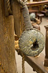 Image showing Old rope and wooden block pulleys