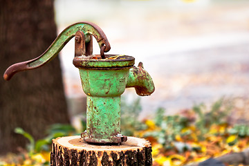 Image showing Rusty olf water pump