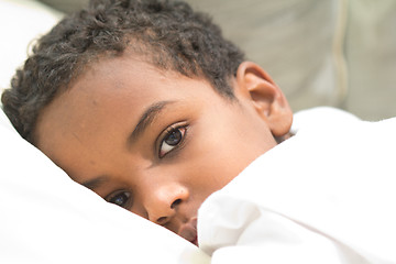 Image showing Boy resting in his bed