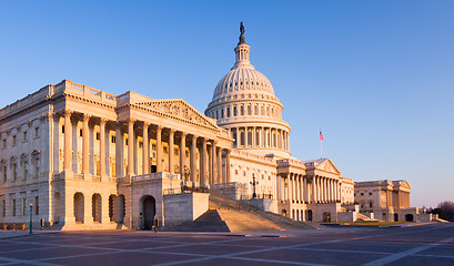 Image showing Rising sun illuminates the front of the Capitol building in DC