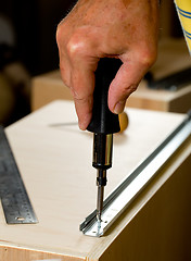 Image showing Woodwork tools working on piece of plywood