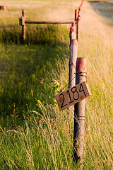 Image showing Countryside Fence with Street Number Sign