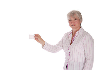 Image showing Senior Woman Passing Blank Business Card