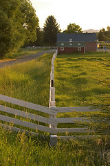 Image showing Countryside Fence Leading to A Ranch