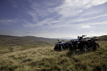 Image showing Pair of ATV quad bikes on lonely mountain