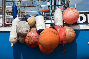 Image showing Colorful boat bumpers