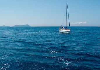Image showing White yacht sailing on calm sea
