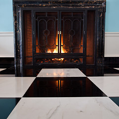 Image showing Old fireplace with logs