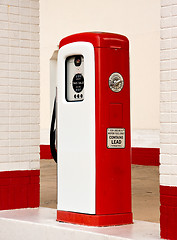 Image showing White and red ancient gas pump