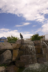 Image showing Small Waterfall in a Strip Mall with Blue Skies