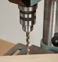 Image showing Close up of drill bit above wood