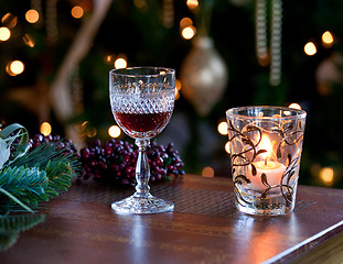 Image showing Glass of sherry or port by candlelight