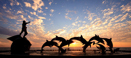 Image showing Dolphin statue in front of sunset