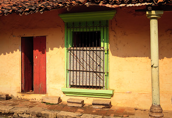 Image showing Old door and window in colorful wall